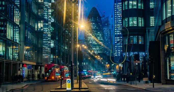 Timelapse view of a busy crossroad at a traffic light in the hearth of the financial district of the City of London