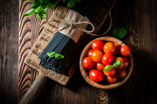 Ingredients for spaghetti with tomatoes and basil