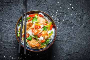 Enjoy your noodle with vegetables and chicken on black rock