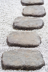 Stone Path of plated stones on gravel bed in Japanese Garden
