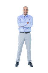 Happy businessman looking at camera with arms crossed 