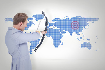 Businessman shooting target against blue world map on white background