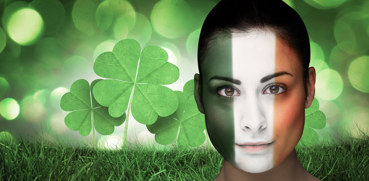 Brunette in irish face paint against green glowing background