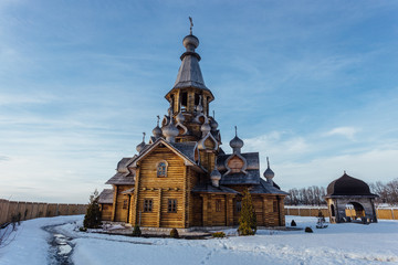 Wooden Russian church in sunny winter day 