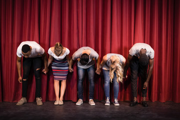 Actors bowing on the stage
