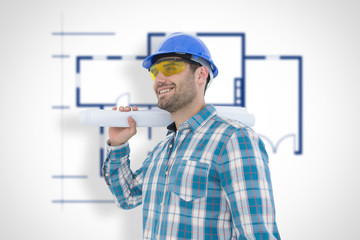 Smiling architect looking away while holding blueprint against blueprint