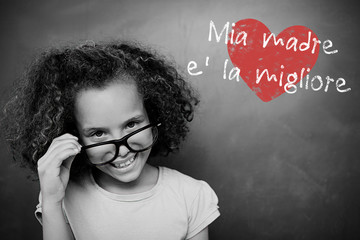 Schoolchild with blackboard against italian mothers day message