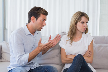 Couple having an argument in living room