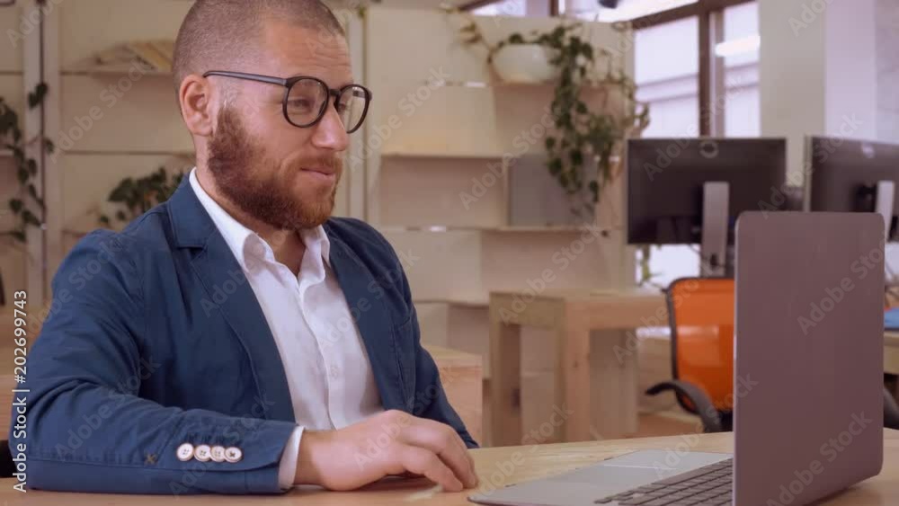 Aufkleber adult businessman has video call conference meeting with business partner. handsome man with beard friendly smiling talking with client use app for call