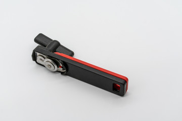 Modern Black and red can opener on a white background