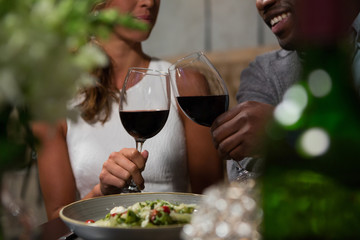 Happy couple toasting wine