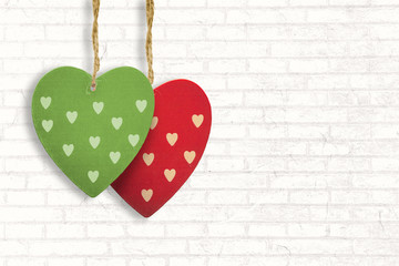 Cute heart decorations against white wall