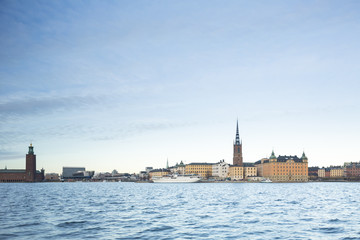Naklejka premium Beautiful scenic panorama of the Old City (Gamla Stan) cityscape pier architecture with historic town houses with colored facade in Stockholm, Sweden. Creative landscape photography