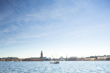 Naklejka premium Beautiful scenic panorama of the Old City (Gamla Stan) cityscape pier architecture with historic town houses with colored facade in Stockholm, Sweden. Creative landscape photography