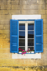 Fototapeta na wymiar Maltese window decorated with flowers