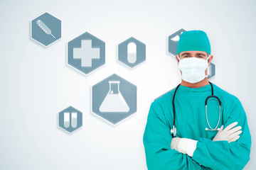 Portrait of an ambitious surgeon against blue medical interface with icons