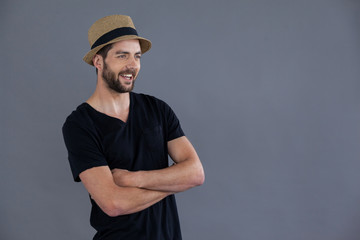 Happy man in black t-shirt and fedora hat