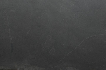 Dark grey black slate background or texture.