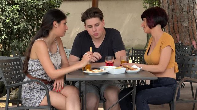Group Of Friends Having Fun In The Bar: Drinking, Talking,joking 
