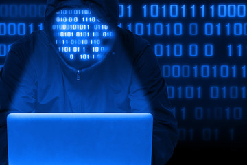 Hacker attack network with notebook on dark blue digital background.