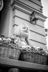 Woman of plus size figure walk at the downtown, old part city street, Europe vacation  