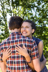 Cute couple hugging in the park