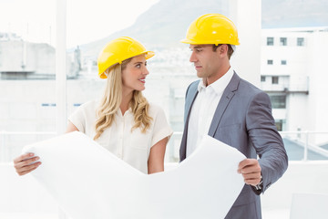 Colleagues working on blueprints