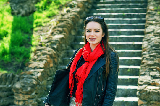 A young woman in the city.Portrait of a young, confident girl .The concept of women's fashion