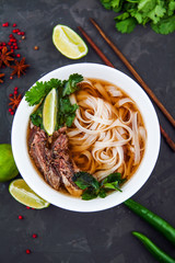 Vietnamese Pho Noodle Soup. Beef with Chilli, Basil, Rice Noodle