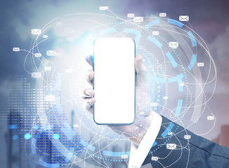 Hand with mock up smartphone, blue city
