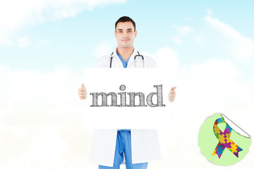 The word mind and portrait of a doctor holding a blank panel against blue sky