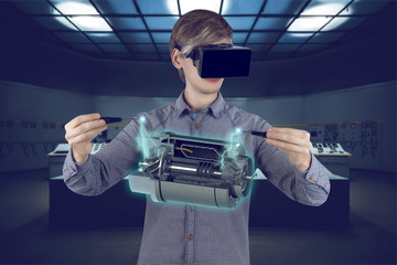 Virtual reality in engineering concept. Male / man engineer wearing shirt and vr glasses fixing...
