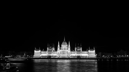 Night view of illuminated Parliament building in Budapest, Hungary. Black and white