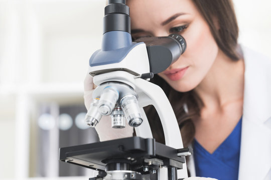 Female scientist with microscope