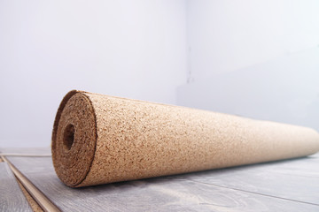natural cork substrate on the floor with laminate
