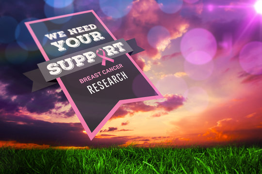 Breast cancer awareness message against green grass under dark blue and orange sky