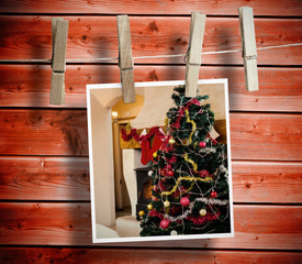 Photo hanging from line against wooden background