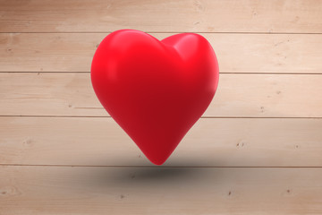 Red heart against overhead of wooden planks