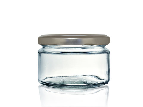 glass jar for canning with iron lid isolated on white background with reflection