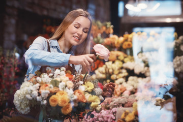 Smiling woman in uniform in a store