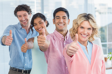 casual businesspeople thumbs up in line