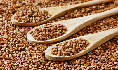 buckwheat groats and wooden spoon