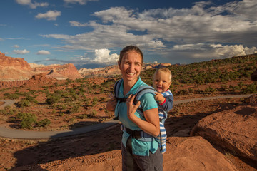 A mother and her baby son visit Capitol reef National park in Utah, USA