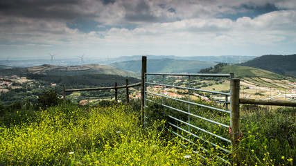 Fototapeta na wymiar Fence on a hilly landscape
