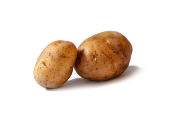 Two potato tubers on a white background. Potatoes close-up.