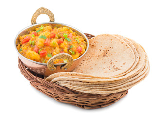 Obraz premium Indian Cuisine Spicy Fried Aloo Also Know as Potato Fry, Potato Curry, Aloo Masala or Alu Masala Served with Indian Bread, Roti or Chapati isolated on White Background