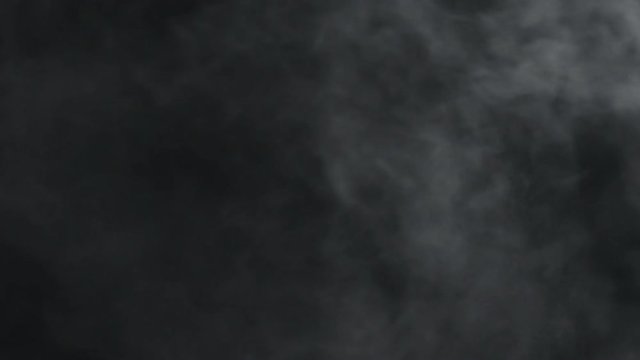 slow motion vapor steam from right side over black background