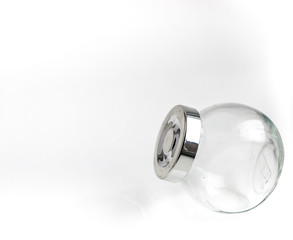 white glass transparent jar with metal lid isolated on neutral background