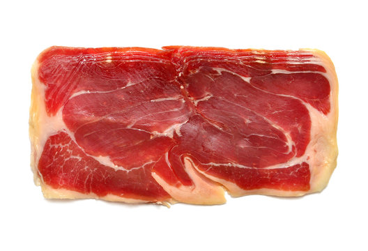 Sliced jamon isolated on white background. Flat lay, top view