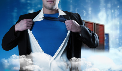 Businessman opening his shirt superhero style against cityscape on cloud © vectorfusionart